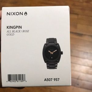Nikon Kingpin - All black / rose gold. New + tags
